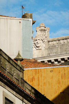 Old porto building with statue of other building as contrast