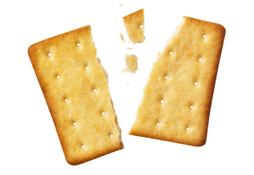 Cracked crispy biscuit split into parts with crumbs, isolated on cutout transparent background