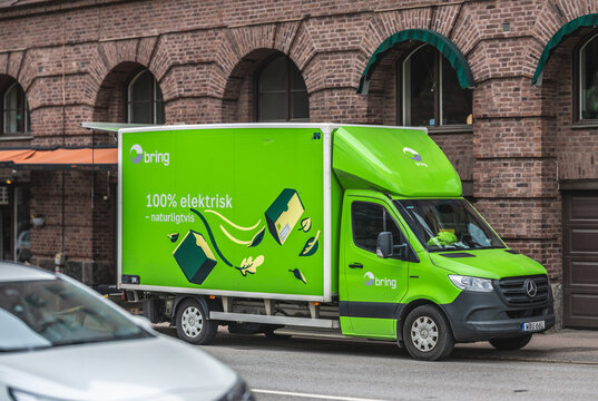 Gothenburg, Sweden - March 29 2026: Green electric delivery truck parked in city promoting sustainable logistics and eco friendly transport.