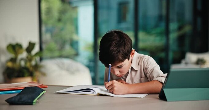 Learning, writing and child on tablet in home for online education, practice and language. Homework, tech and boy with notes, digital streaming or virtual spelling test for development and knowledge