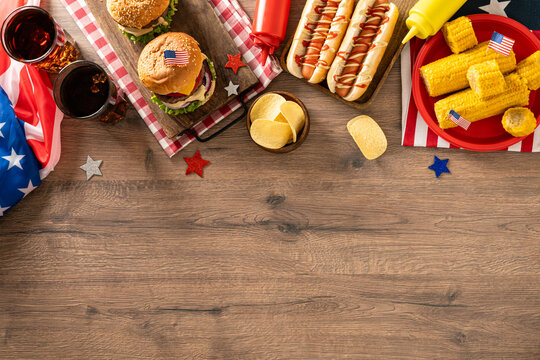 Fourth of July barbecue food background with burgers hot dogs and copy space