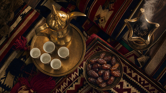 Traditional Saudi Hospitality Scene with Arabic Coffee, Dates and Incense &ndash; Top View