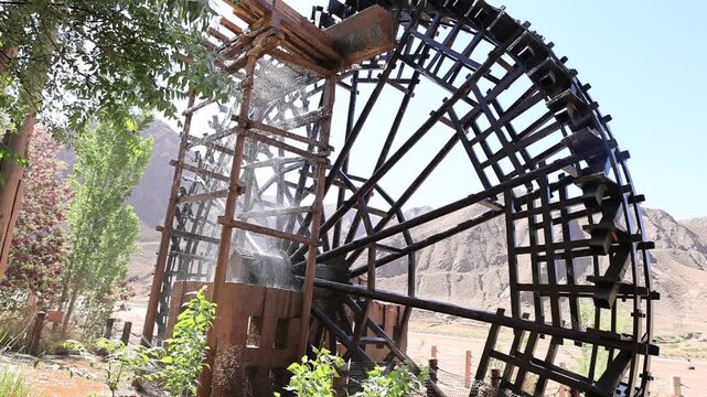 Ancient waterwheels operating on the Gobi Desert along the Yellow River in Beichangtan Yellow River Village, Zhongwei, Ningxia, China.