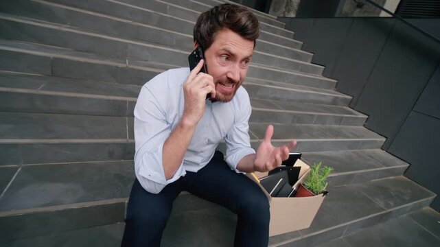 Rage angry furious Caucasian mature business man yelling arguing mobile phone dismissal box city mad male lost job fired unemployed businessman aggressive bankruptcy stressed frustrated worker outdoor