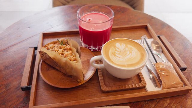 Cozy Cafe Morning Tea Set with Apple Crumble, Latte Art and Fresh Juice &ndash; Cinematic Close-up Handheld Lifestyle Footage