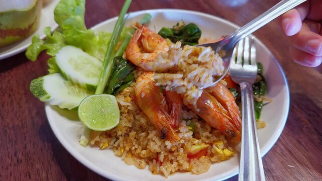 Close-up of Authentic Thai Shrimp Fried Rice &ndash; Spoon Scooping Appetizing Food Shot