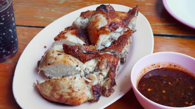 Authentic Thai Grilled Chicken with Spicy Dipping Sauce &ndash; Cinematic Close-up Food Footage