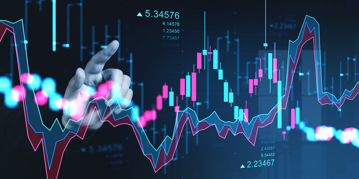Hand interacting with glowing financial trading charts and market data.