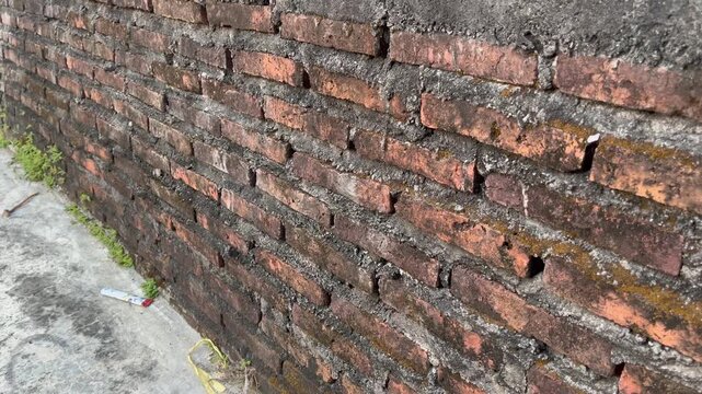 Close up of old red brick wall texture without plaster