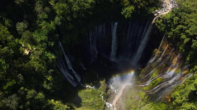 Stunning 4K aerial view of Tumpak Sewu waterfall curtains in East Java, Indonesia.