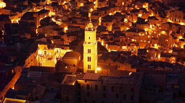 Aerial night view of the illuminated Sassi di Matera, Basilicata, Italy