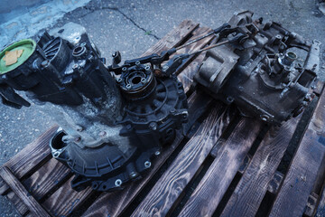 Fototapeta premium old car gearbox dirty from a front-wheel drive car dismantled for repair 
