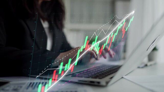 A business professional engages in data analysis using a laptop, with digital financial charts displayed. The image reflects modern investment trends and market growth. Copula