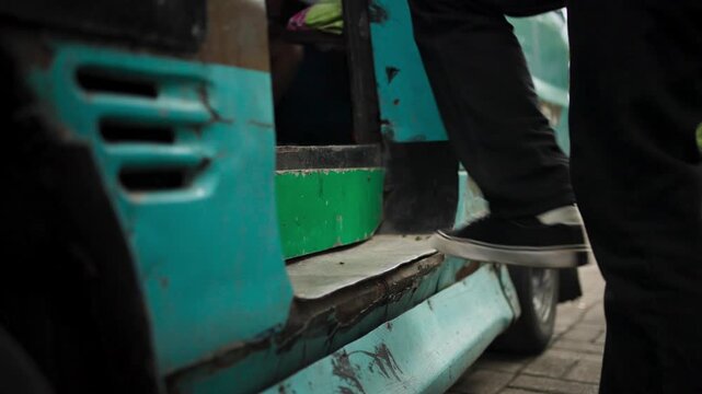 Close-Up of Feet Boarding Public Minibus Pete-Pete