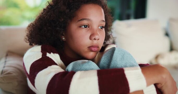 Sad, thinking and child with depression in home, adoption crisis and loneliness with mental health. Reflection, sofa and unhappy girl with anxiety, thoughts and foster care trauma in living room