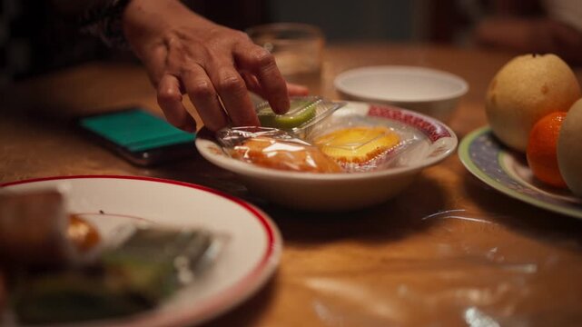 Traditional Makassar Cakes on Plate with Hand Arranging Them