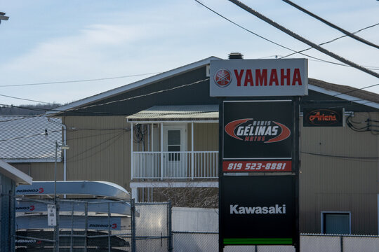 Canada, 12 April 2026 : Yamaha, Gelinas Motos, Kawasaki, and Ariens logos displayed on outdoor business signage at a dealership