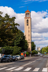 Obraz premium 2025-08-17; Modern church tower rising high beside Raszkowska street in Ostrów Wielkopolski Poland.