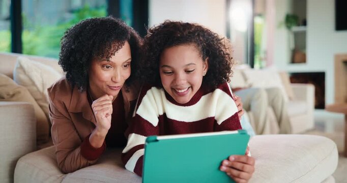 Mother, daughter and tablet with high five in home, winning or level up with online gaming. Relax, tech and woman with girl kid on streaming app, family and gesture for support, winner and games
