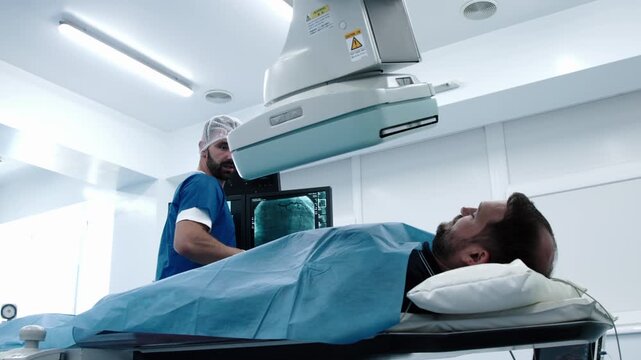 Doctors coordinating patient preparation for angiography, with CT or MRI used as supplementary imaging in hospital diagnostic workflow. Concept vascular imaging, clinical collaboration and healthcare 