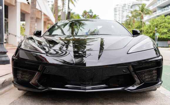 Miami, Florida, USA - May 05, 2025: Chevrolet Corvette C8 2023 sports car. Luxury sport car Chevrolet Corvette. Car Chevrolet Corvette parked outdoor. Black Chevy sportscar, front view.