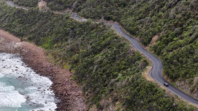 Great Ocean road scenic highway under cliffs on waterfront scenic aerial panorama.