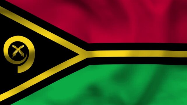 National flag of Vanuatu on wavy cloth. Features red, green, and black sections with a gold emblem and black Y-shape. Top-down view for news and national independence day celebrations.