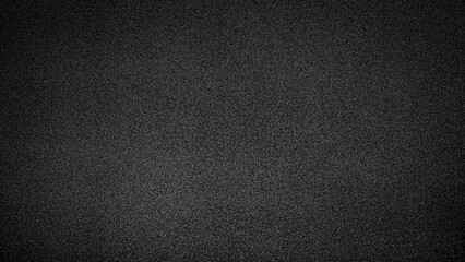 Fototapeta premium Dark textured background showing a blend of fine particles and a subtle pattern