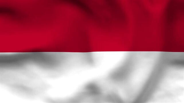 National flag of Monaco on wavy cloth. Features simple red and white horizontal bands. Professional top-down shot for European themes and national holidays.