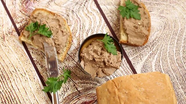 Rustic appetizer with liver pate and parsley garnish