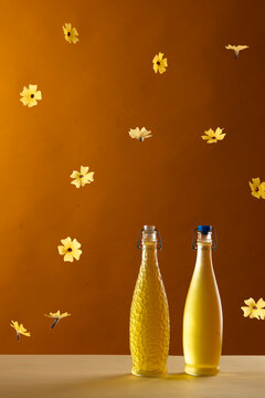 bottles of home made limonchello with yellow flowers