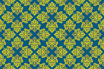 Luxury vintage damask seamless pattern arranged in an elegant diamond grid layout. Classic royal floral ornament background with fleur de lis and leaf details in bright yellow and deep petrol blue. © Thanawat