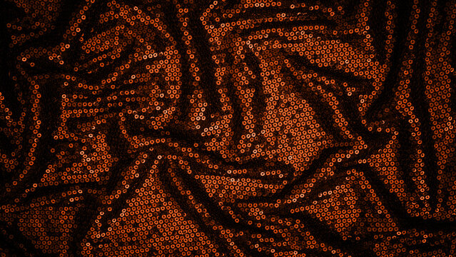 Shimmering fabric with sequins displayed on a dark background during a fashion event