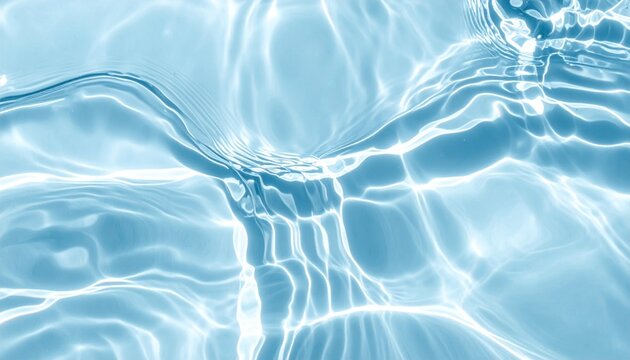 Bright ripples of sunlight dance on a serene blue water surface, creating a soothing visual texture