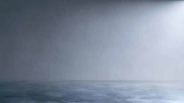 Elegant minimalist neutral grey studio background with diffused lighting perfect for modern design and photography