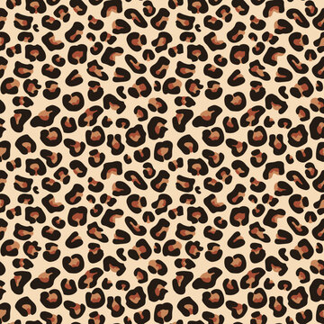 Leopard print is a classic animal pattern featuring distinctive black spots on a beige or brown background.
