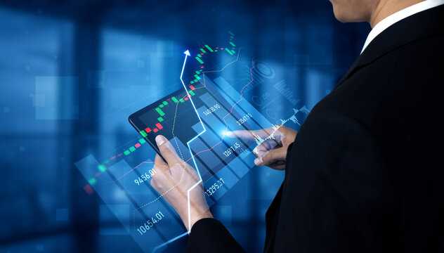 A business professional examines stock market trends on a tablet, showcasing data visualization and analytics in a sophisticated office setting. Scalp