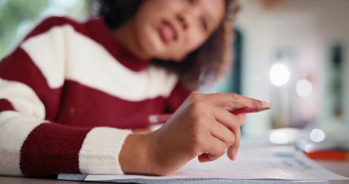 Child, hand and thinking with homework, pencil and writing answer with education for math assignment. Girl, notes and problem solving in home with notebook, knowledge growth and learning development.