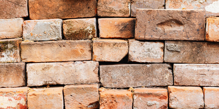 Pile of bricks with visible imperfections and natural colour variations