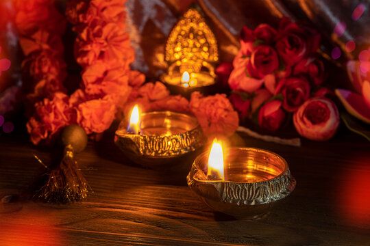 Diwali lamp diya or Deepavali or Deepawali. Hindu festival of lights. Celebrating in Indian religions Jainism and Sikhism. Offering to the gods, a spiritual rite. Close up view, out of focus