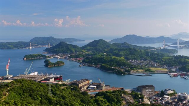 Aerial panoramic view of Yumeshima Kaido islands bridges and harbors in summer Japan
