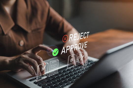 Business professional approving online documents on laptop with digital approve and reject interface,representing workflow automation, invoice management,compliance verification and paperless office.
