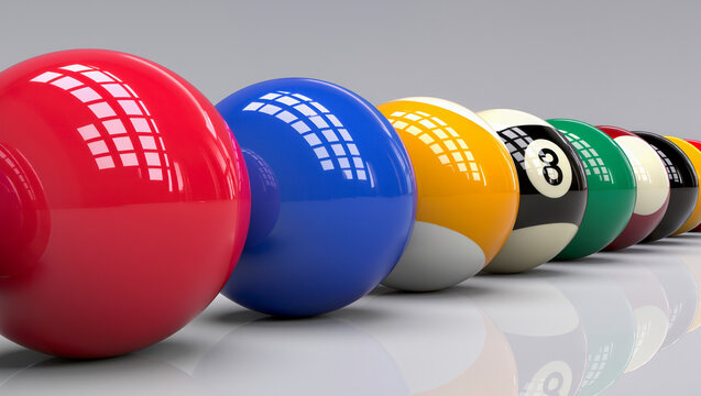 Row of glossy colorful billiard balls with reflections lined up on a smooth gray surface