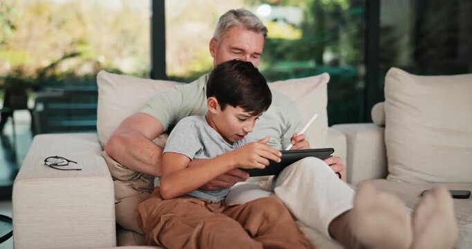 Stylus, tablet and dad with child on sofa for bonding with online games, website and digital drawing. Family, home and father with boy on tech with pen for elearning, internet and relax on weekend