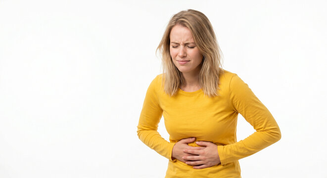 Young Woman Suffering from Acute Pancreatitis Holding Her Stomach in Abdominal Pain on White Background