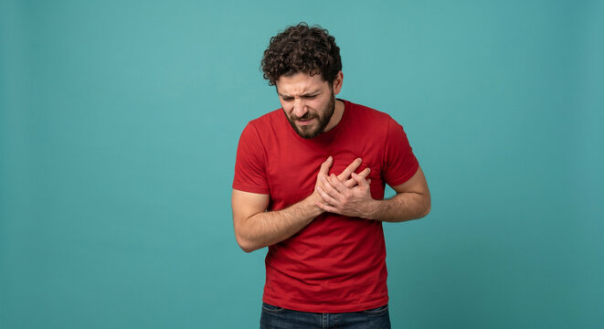 Man Holding Chest in Pain Showing Heart Disease Symptom