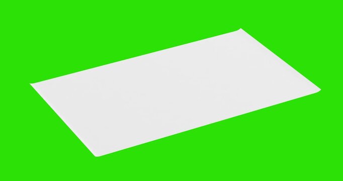 4k Resolution Video: Blank White Mockup Rolled Paper Poster With Clean Surface Opening From Center On Green Screen Chroma Key Background With Alpha Matte