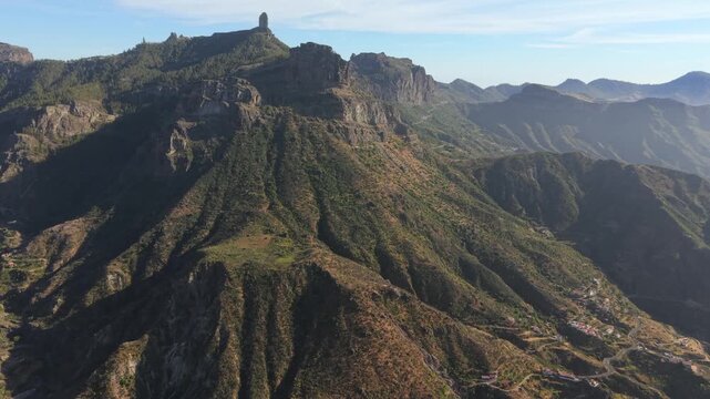 Beautiful panoramic aerial views of Roque Nublo and the volcanic caldera of Tejeda in Gran Canaria, Canary Islands, Spain on a sunny day