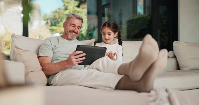 High five, sofa and dad with child on tablet for elearning, educational games and bonding in home. Family, happy and man with kid on tech with stylus for website, internet and answer for online quiz