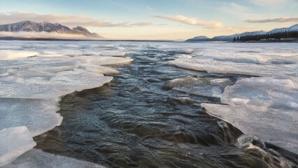 Fototapeta premium verglas. Landscape of a melting river breaking through ice in morning light. travel magazines, destination branding, designed for outdoor magazines and nature guides, drives exploration.